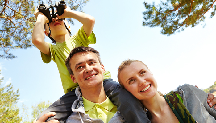 Portrait of family of travelers on summer vacation