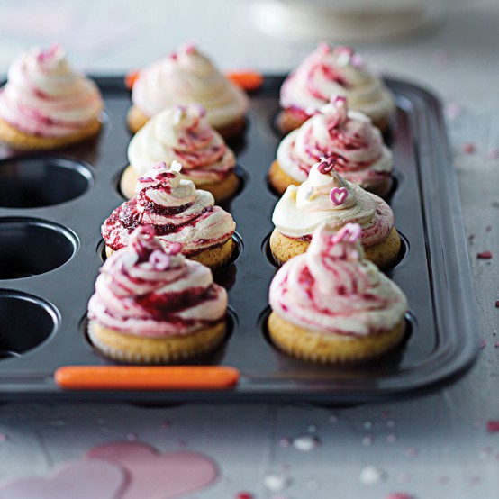 Image of White Chocolate Cupcakes with Raspberry Icing in Le Creuset cookware