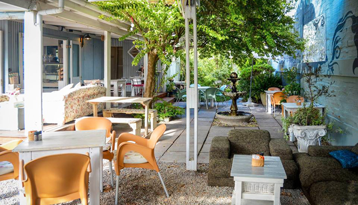 Image of table in garden at The Tin House Café