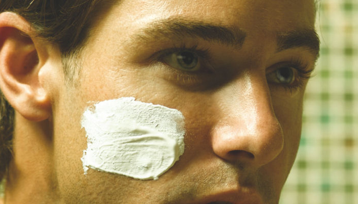 Image of man with shaving cream on cheek