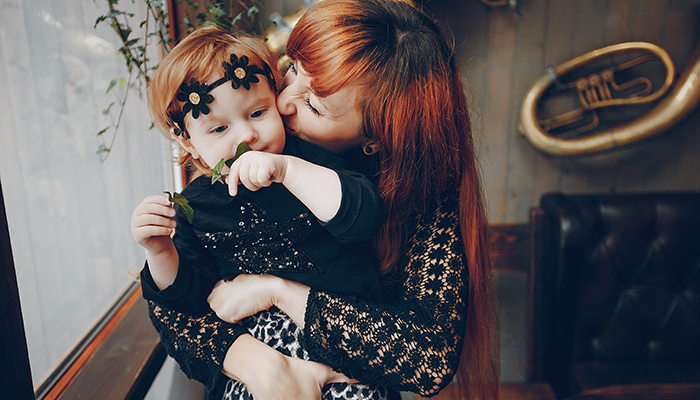Mother and daughter sitting in a cafe, tea and pyut walking in a winter city