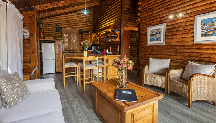 Chalet kitchen with Le Creuset cookware and open-plan layout at The Milkwood Collection