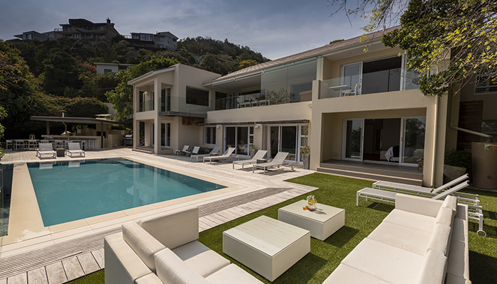 Luxury villa with pool and outdoor seating at Number Eleven, Knysna Heads