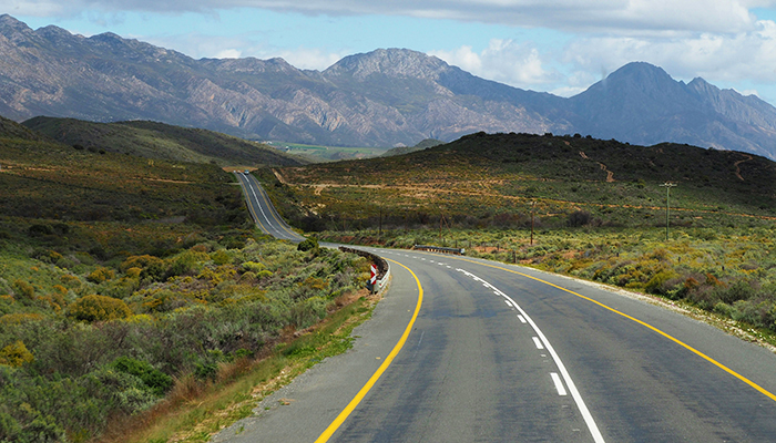 Scenic road winding through the mountains along the Garden Route in South Africa
