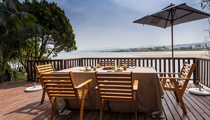 Breakfast table set on the deck at Paquita overlooking the Knysna Lagoon