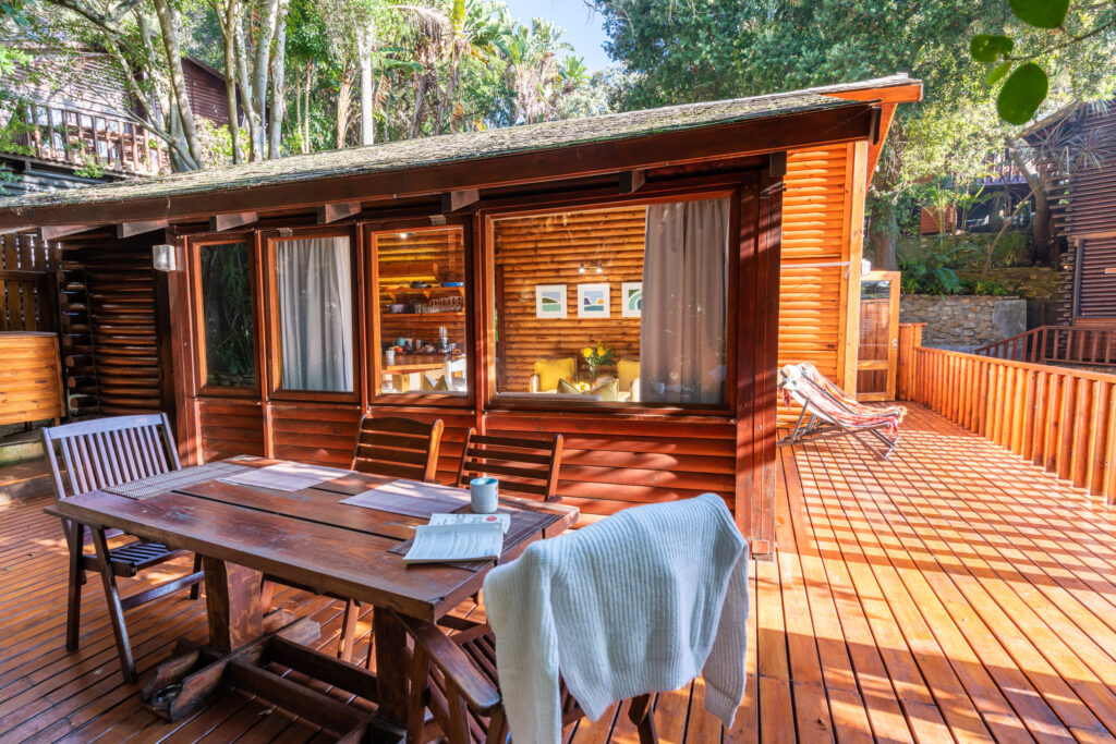 Classic timber chalet deck at Under Milkwood in Knysna
