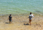Children playing on the lagoon-side beach at The Milkwood Collection in Knysna