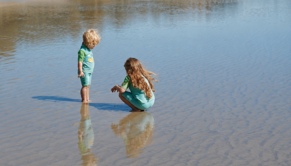 Children exploring shallow water at the Knysna Lagoon