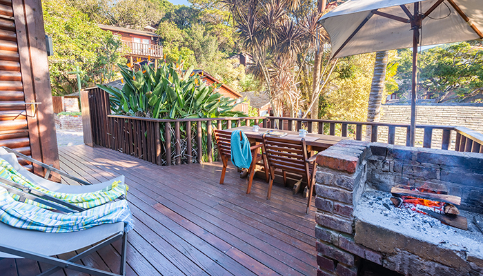 Outdoor braai and deck at The Milkwood Collection in Knysna
