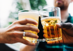 Friends raising glasses of beer during a relaxed drinks tasting