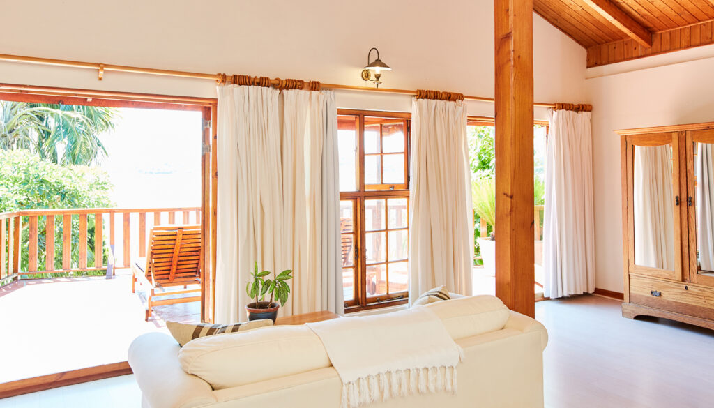 Bedroom at Paquita with doors opening onto the balcony