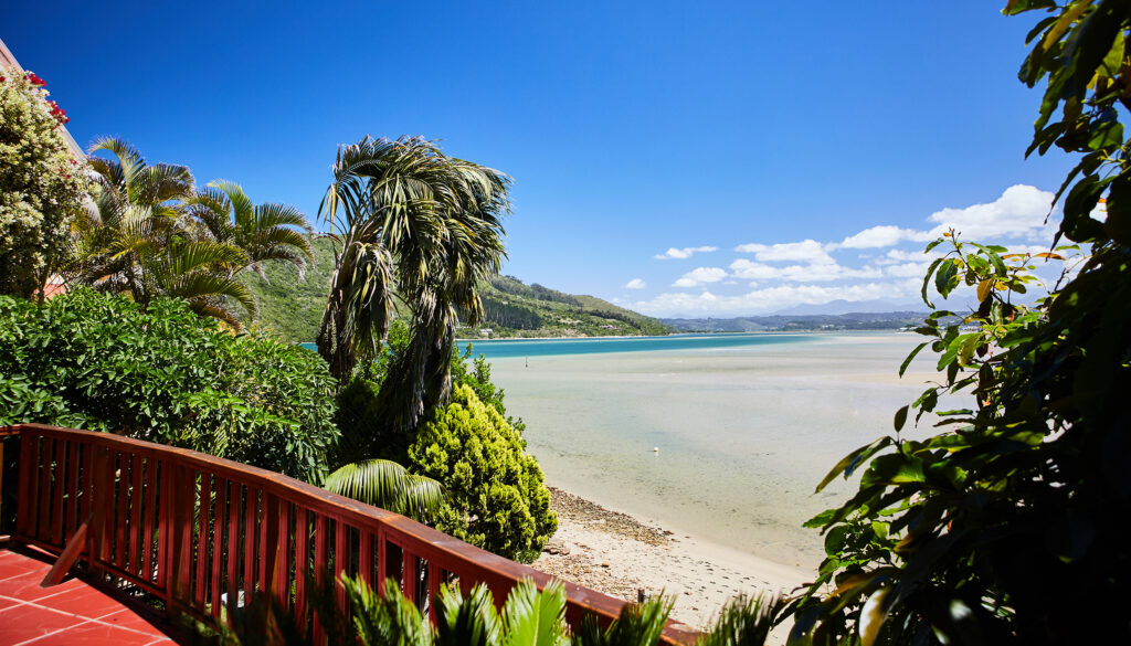 View from Paquita’s deck across the beach and Knysna Lagoon