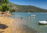 Calm water and small boats on the Knysna Lagoon beside The Milkwood Collection